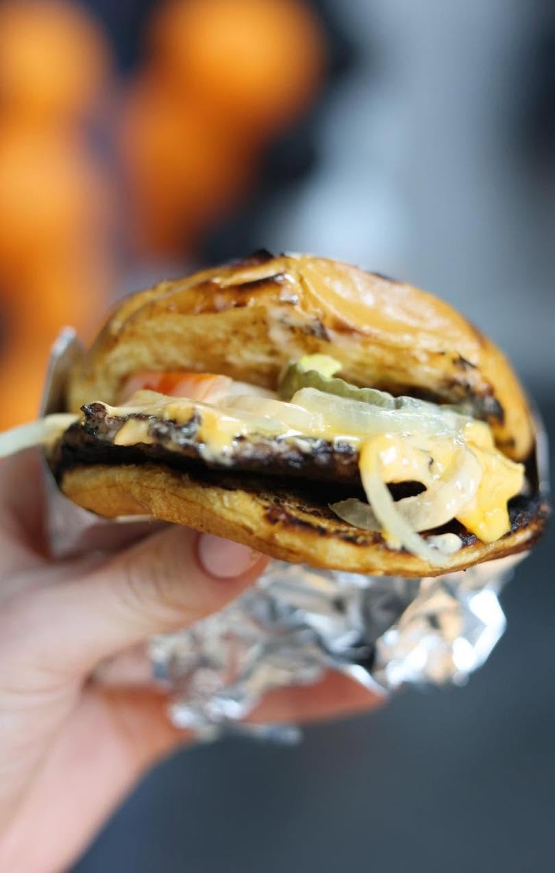Shaban’s takeaway juicy flame grilled burgers with melted cheese pickles and sauce in 
                    Hamilton.