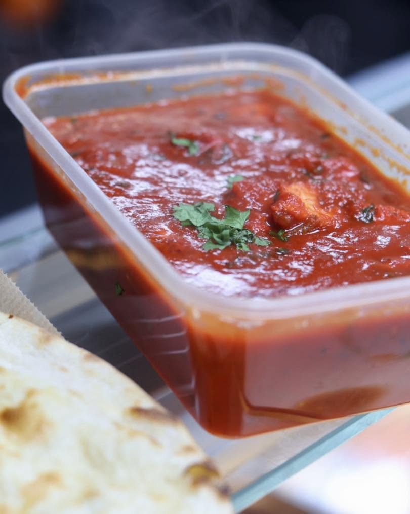 Shaban’s in Hamilton rich red chicken tikka masala curry served with fresh naan bread.