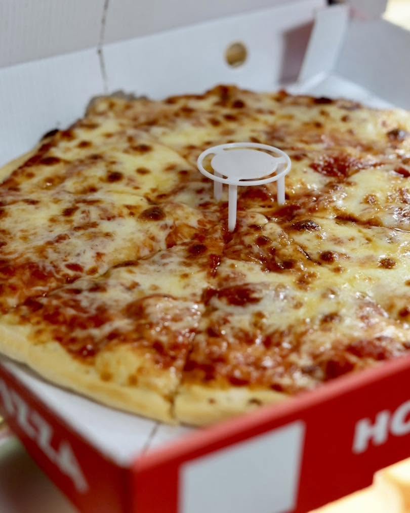Shaban’s in Hamilton freshly baked cheesy pizza in delivery box.
